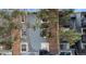 Exterior view of a multifamily home with brick and siding and mature trees at 7881 Allison Way # 204, Arvada, CO 80005