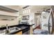 Kitchen with stainless steel sink and view to living areas at 7881 Allison Way # 204, Arvada, CO 80005