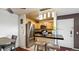 Well-lit kitchen featuring stainless steel appliances and a breakfast bar at 7881 Allison Way # 204, Arvada, CO 80005