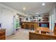 Finished basement featuring a wet bar with seating and additional dining space at 22379 E Dorado Ave, Aurora, CO 80015