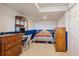Cozy bedroom with blue and white walls, complemented by a well-lit study area at 22379 E Dorado Ave, Aurora, CO 80015