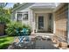 Charming front porch with seating area, creating a welcoming entrance to the home at 22379 E Dorado Ave, Aurora, CO 80015