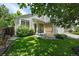 Inviting front yard with lush lawn and cozy seating area, perfect for enjoying the outdoors at 22379 E Dorado Ave, Aurora, CO 80015