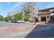 Attractive condo building featuring balconies, well-maintained landscaping, and convenient parking in a desirable location at 5677 S Park Pl # 303, Englewood, CO 80111