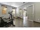 Well-equipped fitness center with various exercise machines and a large glass door at 5677 S Park Pl # 303, Englewood, CO 80111