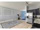 Open-concept space with dining area and a modern kitchen with stainless steel appliances and sleek cabinets at 5677 S Park Pl # 303, Englewood, CO 80111