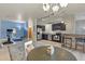 Spacious dining and kitchen area with stainless steel appliances and bar seating, perfect for entertaining at 5677 S Park Pl # 303, Englewood, CO 80111