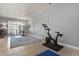 Inviting living room with exercise equipment, natural light, and stylish accents, offering a comfortable atmosphere at 5677 S Park Pl # 303, Englewood, CO 80111