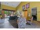 Inviting lobby area with modern furniture, neutral walls, and access to outdoor pool at 5677 S Park Pl # 303, Englewood, CO 80111