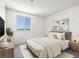 Bright bedroom features neutral decor, a large window, and comfortable furnishings at 1980 S Xanadu Way # 208, Aurora, CO 80014