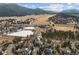 Aerial view of home nestled in a serene neighborhood with picturesque mountain views at 31699 Southern Hills Pl, Evergreen, CO 80439