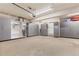 Organized garage with lots of cabinets providing ample storage, epoxy flooring for functionality and clean look at 31699 Southern Hills Pl, Evergreen, CO 80439