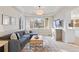 Cozy living room featuring a comfortable sectional sofa, large windows, and stylish decor at 31699 Southern Hills Pl, Evergreen, CO 80439