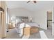 Bright main bedroom featuring vaulted ceilings, neutral carpeting and walk in closet at 31699 Southern Hills Pl, Evergreen, CO 80439