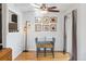 Charming dining area with hardwood floors, a glass table, and a view to kitchen at 1400 Bacchus Dr # C11, Lafayette, CO 80026