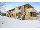 Exterior view of the building with snow-covered ground at 1400 Bacchus Dr # C11, Lafayette, CO 80026