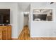 Hallway with hardwood floors and a view into the kitchen at 1400 Bacchus Dr # C11, Lafayette, CO 80026