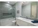 Stylish bathroom featuring a modern vanity, tiled shower with glass door, and elegant fixtures at 10805 Evergold Way, Highlands Ranch, CO 80126