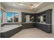 Luxurious primary bathroom with a soaking tub, custom cabinetry, and ample natural light at 10805 Evergold Way, Highlands Ranch, CO 80126