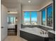 Relaxing tub in a bathroom with stunning mountain views at 10805 Evergold Way, Highlands Ranch, CO 80126