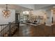 Spacious dining room with wood floors, a large window, and a decorative chandelier at 10805 Evergold Way, Highlands Ranch, CO 80126