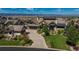 Beautiful home featuring a large driveway and lush landscaping set against a mountain backdrop at 10805 Evergold Way, Highlands Ranch, CO 80126