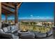 A luxurious outdoor patio area, complete with a fire pit and comfortable seating, perfect for relaxation at 10805 Evergold Way, Highlands Ranch, CO 80126