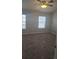 Spacious bedroom with carpeted floor and ceiling fan at 8436 E 35Th Ave, Denver, CO 80238