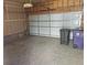 Attached garage with overhead door and concrete floor at 8436 E 35Th Ave, Denver, CO 80238