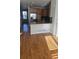 Eat-in kitchen with hardwood floors, stainless steel appliances, and granite counters at 8436 E 35Th Ave, Denver, CO 80238