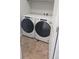 Laundry room with front-load washer and dryer at 8436 E 35Th Ave, Denver, CO 80238