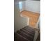 Carpeted stairs leading to a hardwood floor landing at 8436 E 35Th Ave, Denver, CO 80238