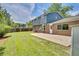 Expansive back yard with lush lawn, patio area, and fenced perimeter at 2122 S Zephyr St, Lakewood, CO 80227