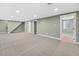 Spacious finished basement with neutral gray walls and carpet, and bright recessed lighting at 2122 S Zephyr St, Lakewood, CO 80227