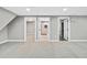 Finished basement boasts neutral carpeting and provides access to bathroom, laundry and closet areas at 2122 S Zephyr St, Lakewood, CO 80227