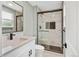 Bathroom with seamless glass shower and modern fixtures at 2122 S Zephyr St, Lakewood, CO 80227