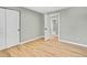 Bedroom with hardwood floors, neutral walls, white doors, and trim providing a clean and modern space at 2122 S Zephyr St, Lakewood, CO 80227