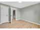 Bedroom featuring hardwood floors, neutral walls, and white trim, creating a bright and inviting atmosphere at 2122 S Zephyr St, Lakewood, CO 80227