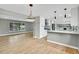 Modern kitchen with stainless steel appliances, gray subway tile, and hardwood flooring at 2122 S Zephyr St, Lakewood, CO 80227