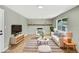 Living room with decorative brick fireplace and plush seating at 2122 S Zephyr St, Lakewood, CO 80227