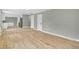 View of living room with hardwood floors that opens to the kitchen and additional rooms at 2122 S Zephyr St, Lakewood, CO 80227