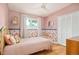 Charming bedroom features light pink walls, floral wallpaper and a hardwood floor at 2849 E Cresthill Ave, Centennial, CO 80121