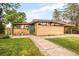 Attractive ranch-style home with unique architecture, manicured lawn, and charming curb appeal at 2849 E Cresthill Ave, Centennial, CO 80121