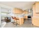 Bright, remodeled kitchen with stainless steel appliances and an eat-in island, adjacent to the dining area at 2849 E Cresthill Ave, Centennial, CO 80121