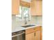 Modern kitchen featuring a stainless steel sink, updated fixtures, and ample counter space for meal prep at 2849 E Cresthill Ave, Centennial, CO 80121