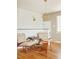 Bright sitting area boasts hardwood floors, modern lighting, and stylish mid-century modern decor at 2849 E Cresthill Ave, Centennial, CO 80121