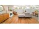 Comfortable living room featuring hardwood floors, neutral paint, and a brick fireplace at 2849 E Cresthill Ave, Centennial, CO 80121