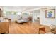 Spacious living room featuring wood floors, modern furniture, ample natural light, and an open floor plan at 2849 E Cresthill Ave, Centennial, CO 80121