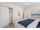 Comfortable bedroom with a closet and a picture on the wall at 128 S Lowell Blvd, Denver, CO 80219
