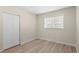 Bright bedroom with a large window and a closet, offering ample natural light at 128 S Lowell Blvd, Denver, CO 80219